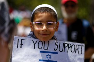 Young boy at the ceasefire now rally Melbourne