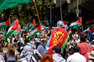 Melbourne ceasefire now protestors sit at an intersection.