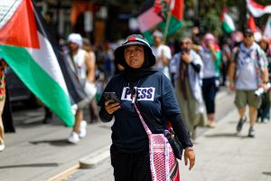 Woman at ceasefire in Gaza rally, Melbourne.