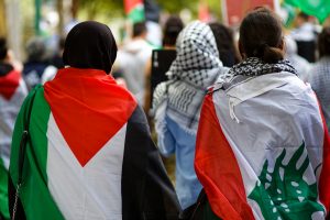 Women wearing flags making their way back to the State Library, Melbourne.