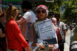 Showing support for Palestinians in Gaza at a Melbourne ceasefire now rally.