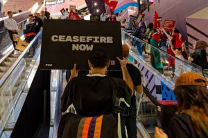 Protesters enter the Melbourne Central Shopping Centre. Photo: Wayne Jansson