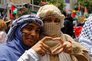 All you need is love? Two women make a love heart together.