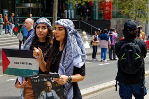 Two women at a ceasefire now rally, Melbourne.