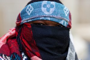 A man who arrived early at the ceasefire now rally, Melbourne.