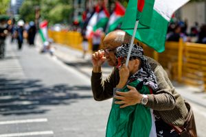 A tourist has his photo taken with a young boy, Melbourne.