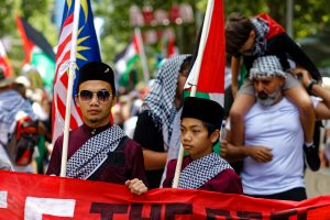 A Malaysian father and son showing solidarity with Palestinians.