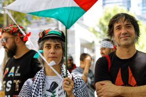 Woman with a kite in memory of Refaat Alareer.