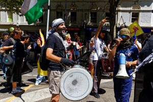 The drum major at Melbourne cesaefire rallies, Jad Abu Alsendyan