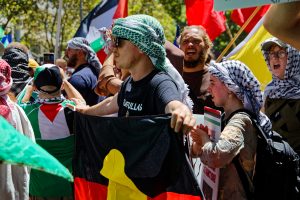 Man with an Aboriginal flag.