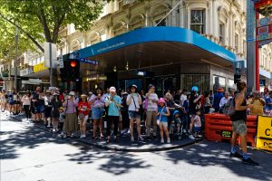 Crowd watch the ceasefire now rally.