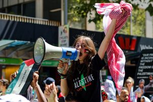Young girl leads the chant.