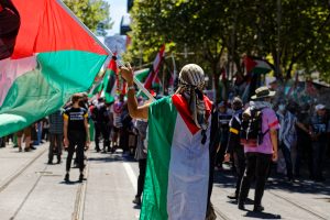 Man flying the Palestinian flag.