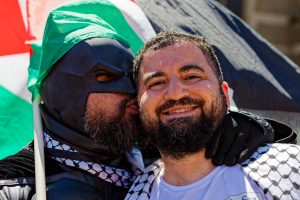 Batman kisses Hash Tayeh.