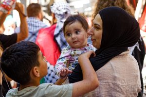 Family marching in Melbourne.