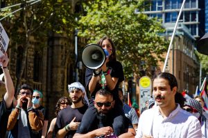 Young girl leads the chant for a Gaza ceasefire.