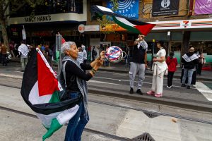 Woman at Melbourne's ceasefire now rally.