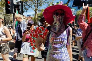 Woman with a watermelon fan.