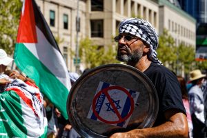 Man marching for a #CeasefireNOW in Gaza.