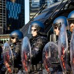 Allan's Victorian government set the riot squad against March for humanity. Photo: Wayne Jansson
