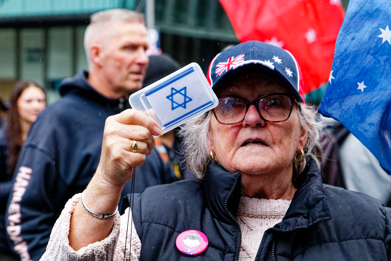 A Zionist proudly displaying her Israeli flag card during the Naarm/Melbourne Nazi march. Photo: Wayne Jansson