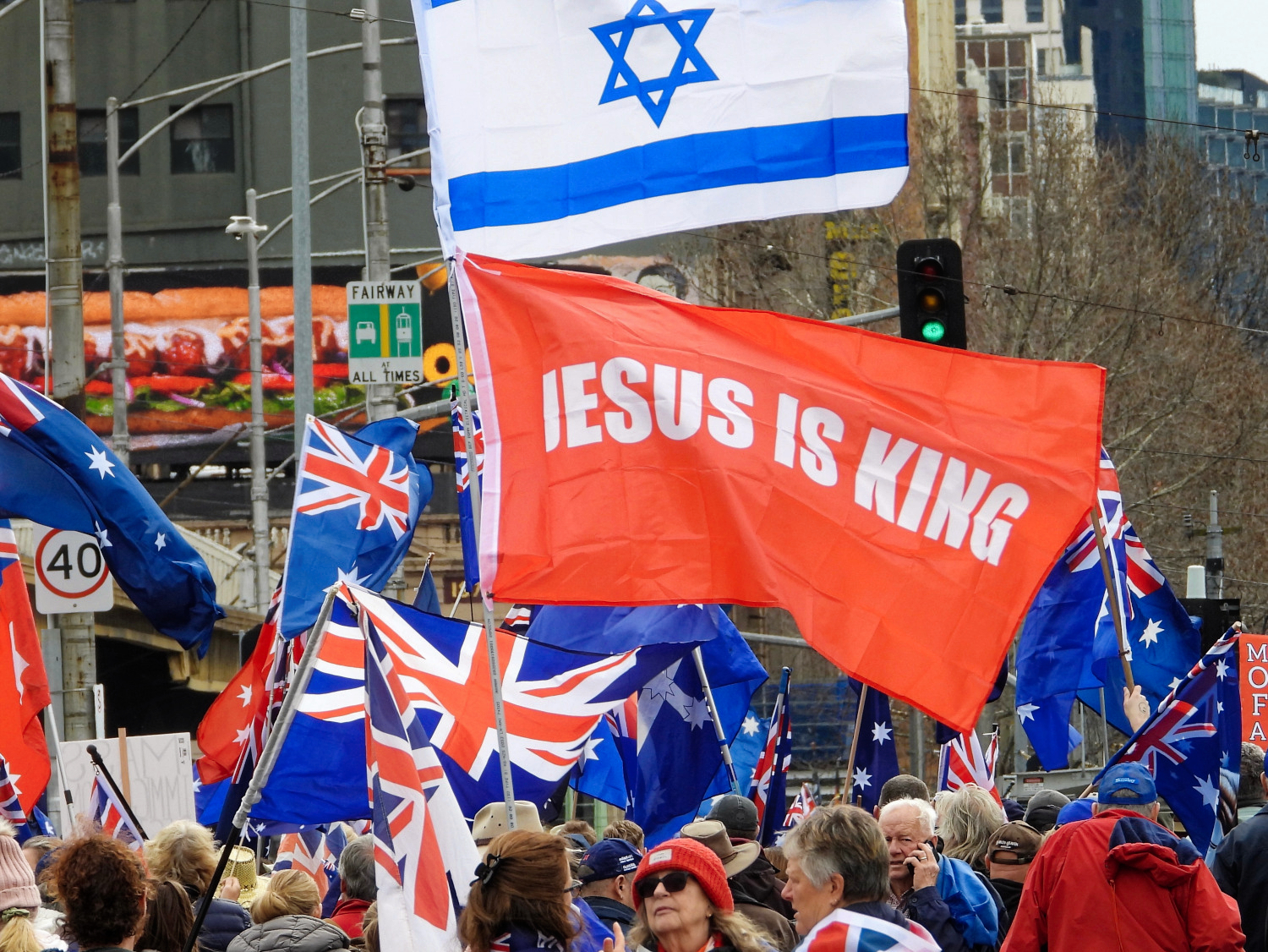 A Zionist flying the Israeli flag at the neo-Nazi march in Naarm/Melbourne. Photo: Aaron Smith